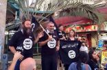 يهود متشددين يرتدون ملابس تحمل شعار داعش احتفاء بمجازرها التي تفعلها بالمسلمين.